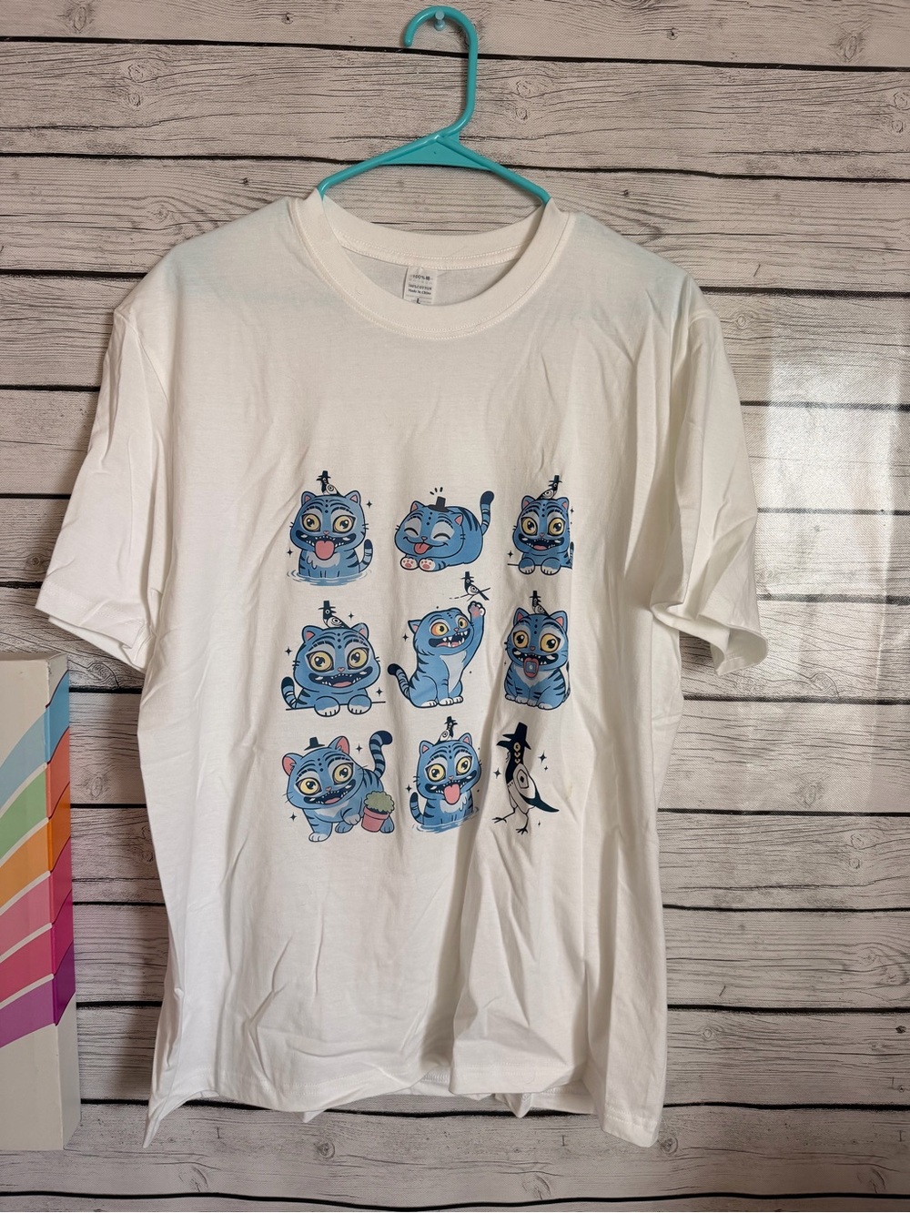 White Graphic Tee with Blue Cartoon Cat Panels